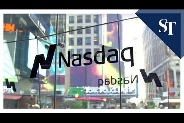 Nasdaq berakhir di atas 9.000 untuk pertama kalinya, Dow juga mencapai rekor